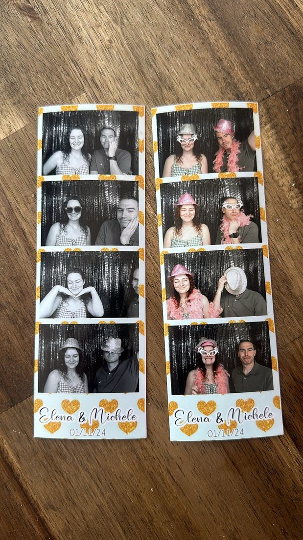 Two wedding photo strips held up under a chandelier